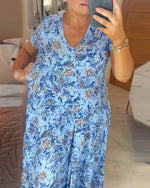 👗 Rochie cu imprimeu floral și decolteu ascuțit